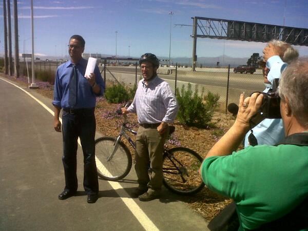 CaltransD4's tweet photo. Spokesman Andrew Gordon briefing the media at the new bike/ped path leading to the new Bay Bridge. http://t.co/fAk3U07VCE