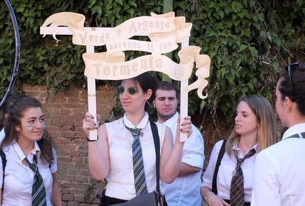 Hairac's tweet photo. #slytherinpride translation:"Green and Silver will be your torment" quidditch banner from last potter convention &amp;Me http://t.co/3nxHH6LSFh