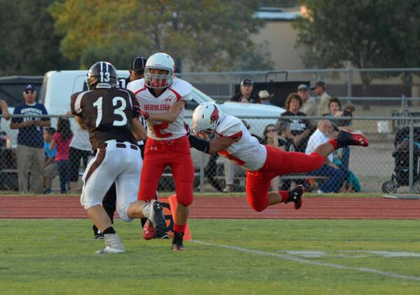 gibsonimages's tweet photo. Jacob Guzman dives in for the touchdown during the Hermleigh football game Friday night at Sands. http://t.co/1KGSI0aEr2
