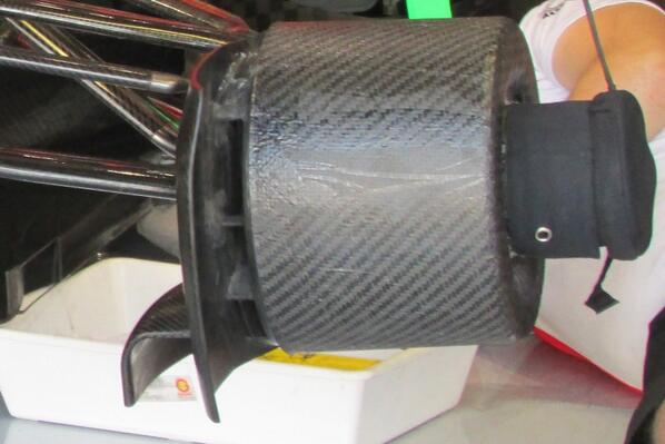 ScarbsTech's tweet photo. Marussia fits these cover around the hub with heaters to pre-warm the asssembly #MonzaTech http://t.co/KdGgghMB5E