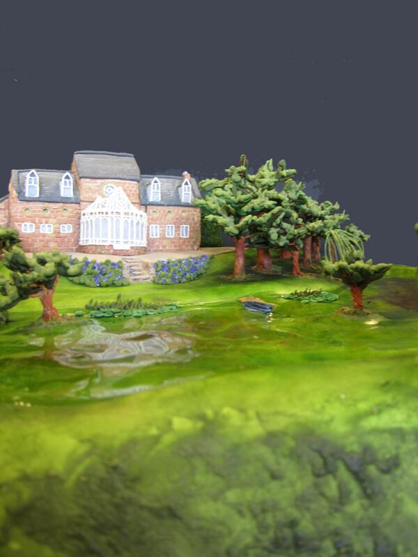 emmabscakery's tweet photo. The Lake House, complete with, lake koi carp, trees and a little rowing boat. http://t.co/d99eB7hjjY