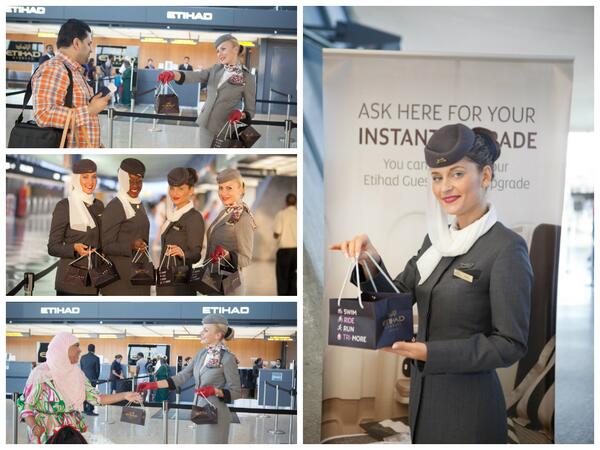 etihad's tweet photo. Our Cabin Crew surprised and delighted guests with commemorative #NationsTri cupcakes at @Dulles_Airport! #DC http://t.co/dvJuE277JS