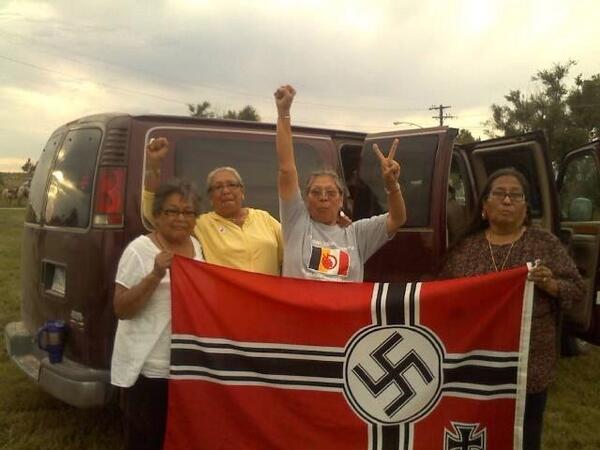 ckaratnytsky's tweet image. #Antifa #NativeResistance We are one. MT @lastrealindians Lakota/Dakota #grandmothers capture Nazi flag/burn it