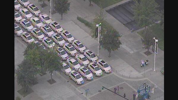NBCDFW's tweet photo. Check out all those pink @MaryKay Cadillacs as they get ready to rally through downtown Dallas #Happy50th http://t.co/cJSrNMia1O