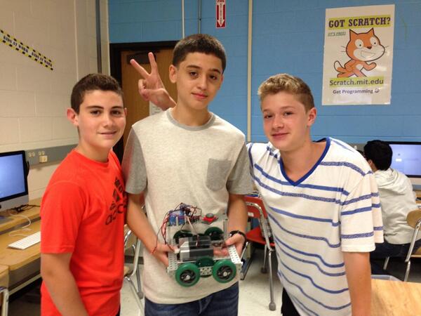 STEM 8 students love working with their VEX robot!