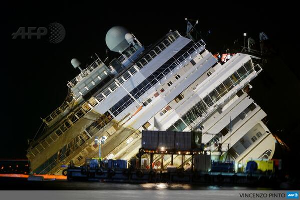 AFP's tweet photo. Italy cruise wreck Costa Concordia rises from sea in record salvage http://t.co/3LtX6OLjuR http://t.co/HWRpAU4Rkg