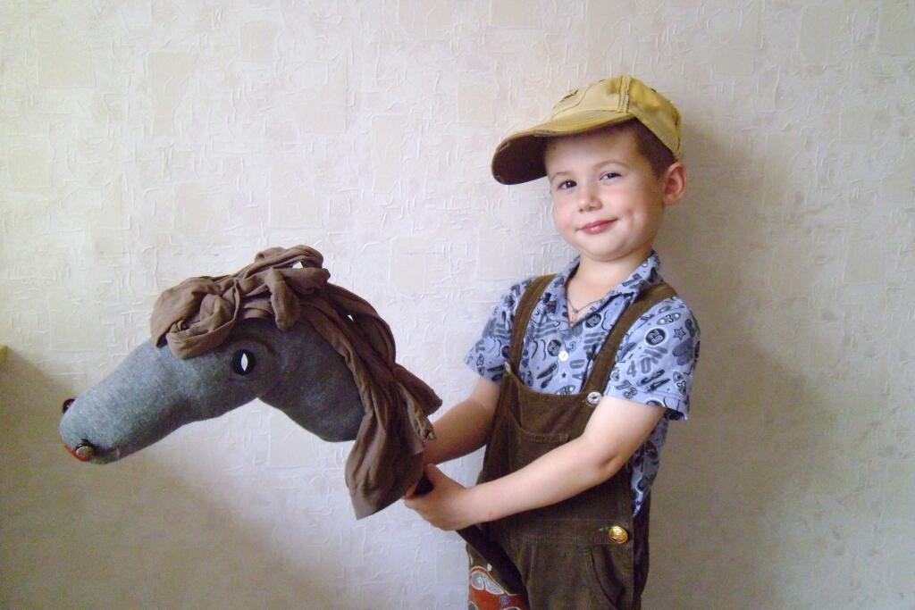 toy horse head on stick with nylons as horse hair