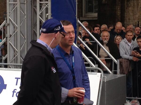 Tour announcer Joe Fisher catches up with ITV's Ned Bolding at the start line