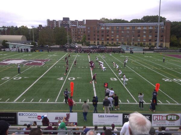 At the Mac Homecoming football game v. Waterloo Warriors. Touchdown 1 accomplished and first Waterloo QB sack