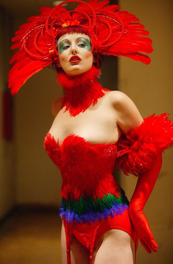 peacockblue's tweet photo. Throwback Thursday! 2005 Birds of Paradise Collection: Lady Red Macaw ensemble. Model: Storm, Photo: H. James Hoff http://t.co/3PSDwfCdss