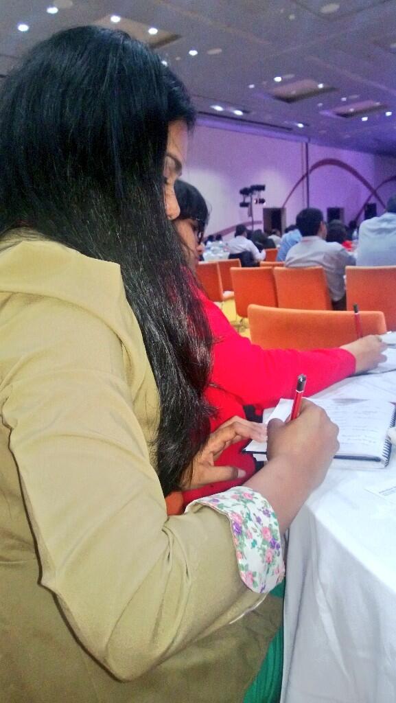 Maddy_Kochar's tweet photo. So much to learn as evident from the serious note-taking by my #tablefriend @PurtiSimon at #PRAXIS2013 http://t.co/qT0TzcYPIH