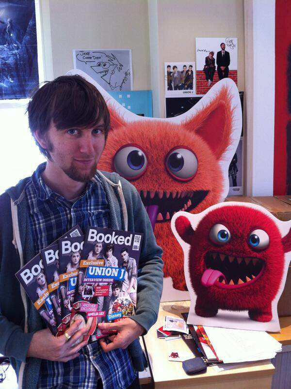 The editor of Booked magazine with the latest issue and a few monsters.
BookedMag.co.uk