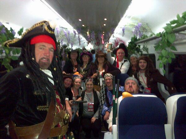 IrishRail's tweet photo. It may be early in the morning but the Sea Shanty seekers are entertaing us on #BigMusicWeek train! http://t.co/0mJj3WT78K