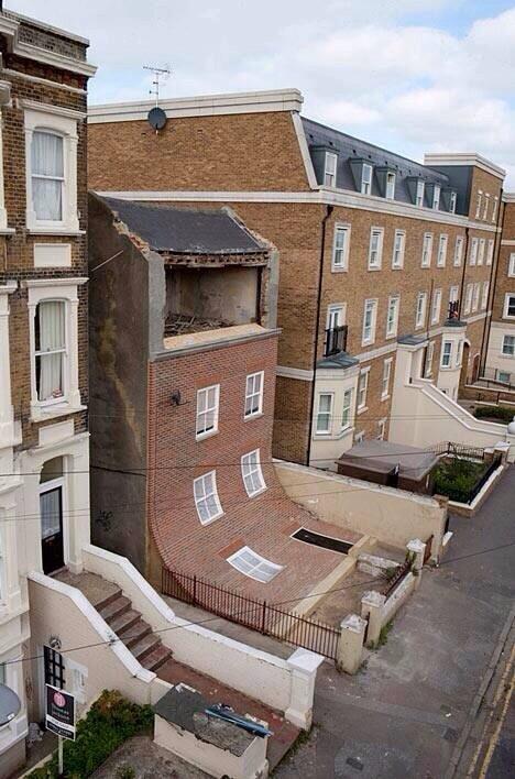 _ayeshamalik_'s tweet photo. 'Sliding House' art piece in Margate called "From the knees of my nose to the belly of my toes" by Alex Chinneck http://t.co/JrsFjkioZX