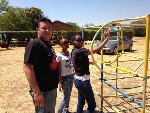 AbrahamKPotch's tweet photo. The power of 5fm! Potch takeover! Volunteers painting the jungle gyms! How awesome #potch5 http://t.co/PlDOQWucIo