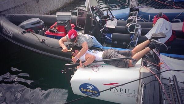 Day 2 <a href="/extremesailing/">Extreme Sailing</a> big breeze again today! Putting the rudder back on before racing! #rudderon #bowdown