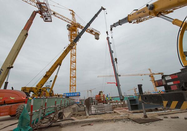 WaltDisneyCo's tweet photo. Shanghai Disney Resort marks official start of vertical construction: http://t.co/qahGErnFHM http://t.co/pF1EdYO4Lm