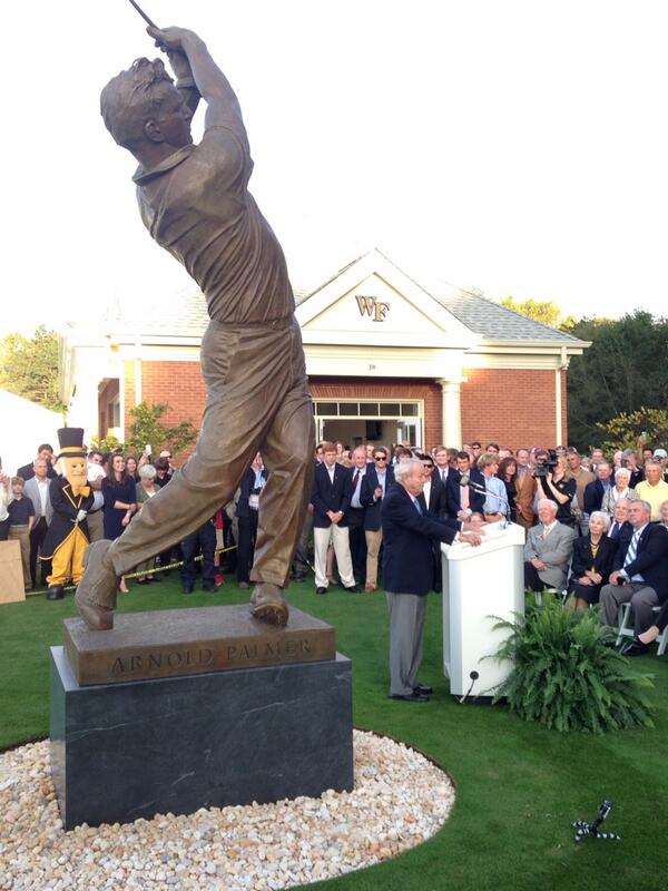 DemonDeacons's tweet photo. Arnold Palmer speaks in the shadow of his newly unveiled trophy http://t.co/rgLEDc6k2e