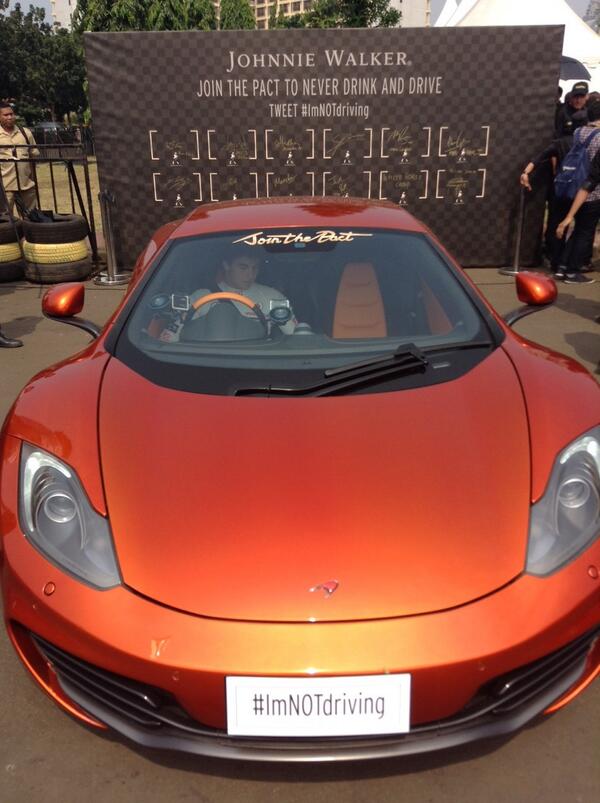 McLarenF1's tweet image. Checo prepares to give the spectators in Jakarta a treat in the 12C at the @JohnnieWalkerID #ImNOTdriving event.