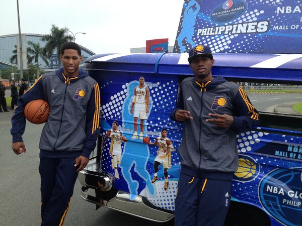 Krissy_Myers's tweet image. . @Paul_George24 and @dgranger33 pose with their photos on the #nbaglobalgames jeepney in Manila