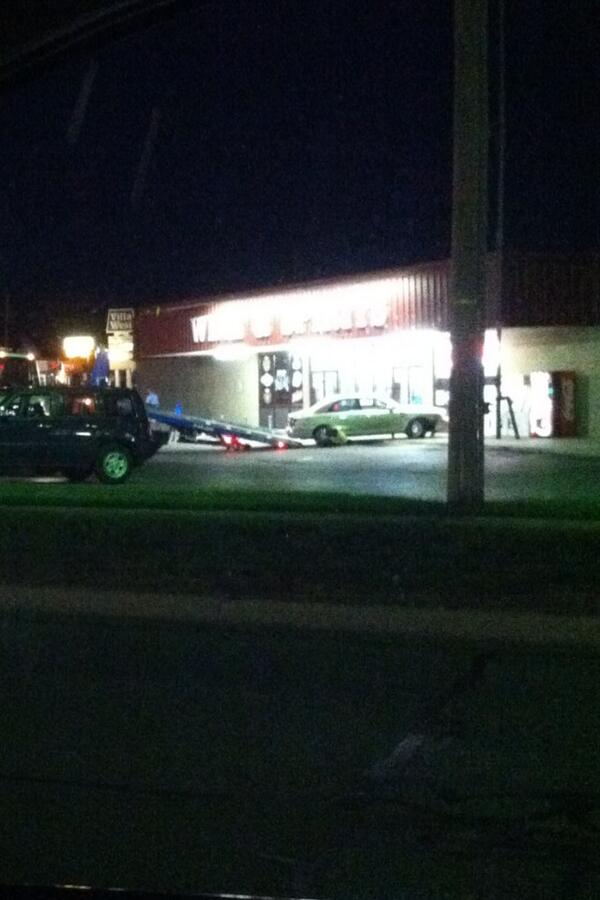 mmosack's tweet image. Glad #Devlins put in cement pylons. Probably only thing that kept this car from plowing thru store. #TopekaEpidemic