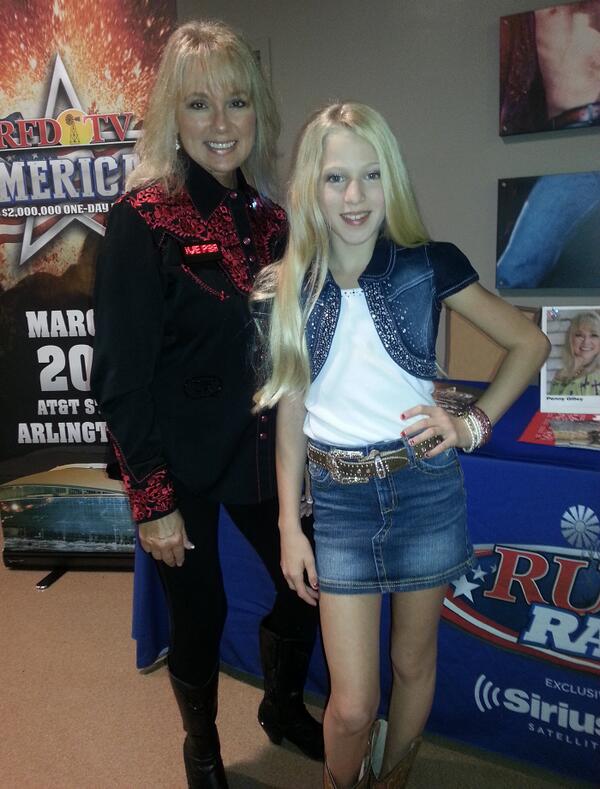 At RFD-TV booth at PBR in Hollywood, FL with Savannah Maddison, who collected 50,000 letters to send to soldiers.