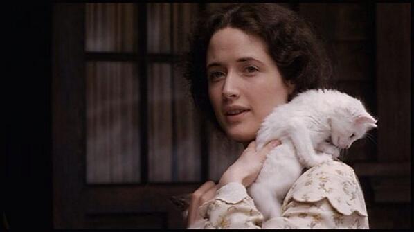 -stands outside walking up the the estate with my cat in hand looking up at the estate- A new start. A new life