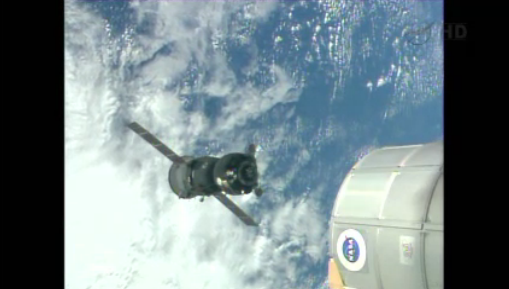 NASA's tweet image. A good view of the Soyuz as three #Exp37 crew back away from #ISS to ~180 meters before moving to their new port 