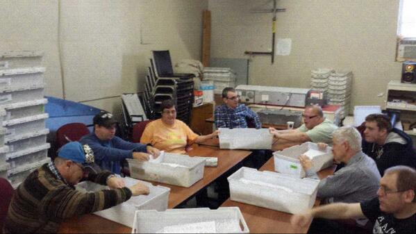 The staff at The Mailbag, a Jobs Unlimited Enterprise preparing a mail-out for Meals On Wheels. #socialenterprise