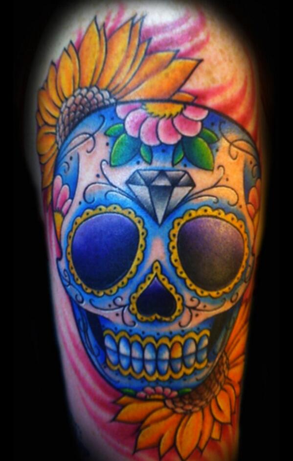 Colorful sugar skull with roses tattoo on left thigh for women