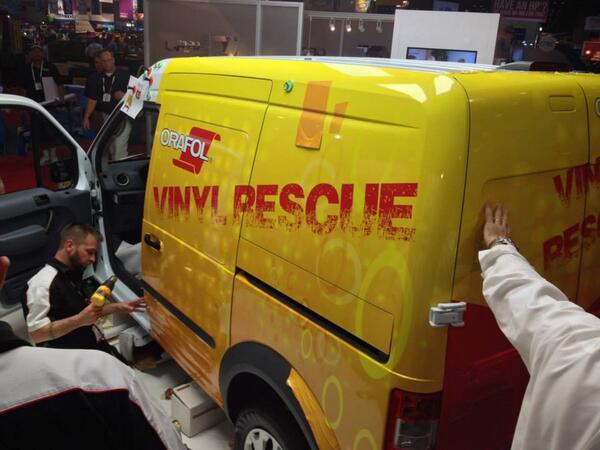 PHOTO of the <a href="/PantherGraphix/">Panther Graphics</a> team in action wrapping an <a href="/ORAFOL_Americas/">ORAFOL Americas</a> "Vinyl Rescue" van at #SGIAExpo: