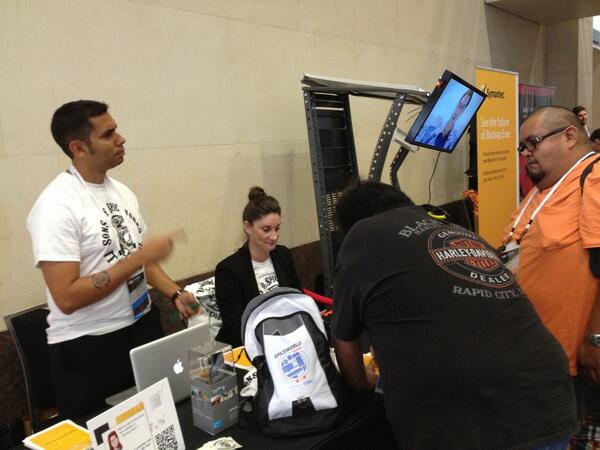 symantec's tweet photo. "@Digital_Kru: Tattoos and SpiceRex @symantec booth. Check in later for @packmatt73 and The Suit. http://t.co/C15dId9doc" #SpiceWorld2013