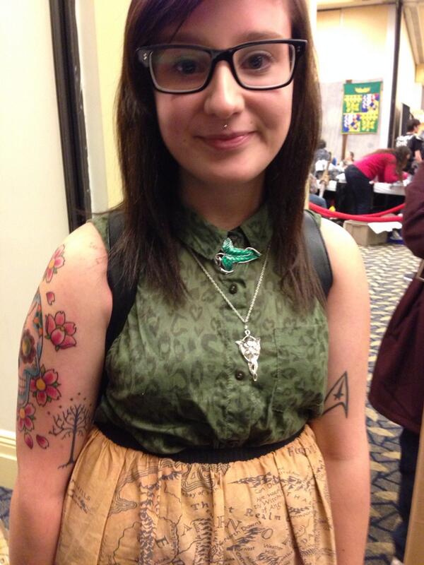 GarrettRWang's tweet photo. LOTR broach and pendant necklace, also Trek,LOTR &amp; Dia de Los Muertos tattoos! All bases covered:) #HalCon4 http://t.co/uN3vDRj8h9