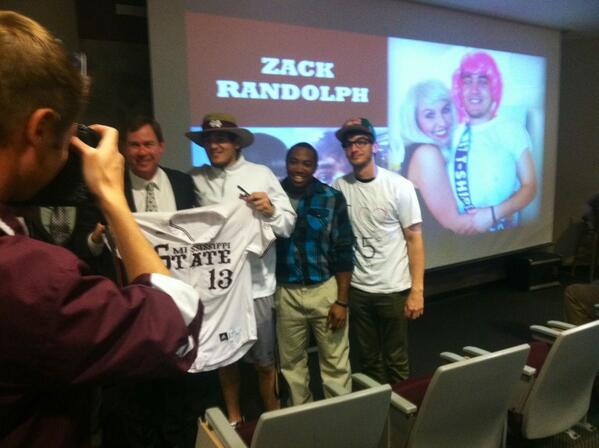 Zack Randolph, dressed as a John Cohen action figure, receives his uniform from Commissioner Cohen and captains