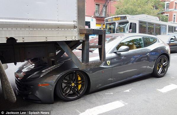 DailyMail's tweet image. Brand new $300k Ferrari is crushed by a delivery truck and given ticket for double parking dailym.ai/1atgqsb