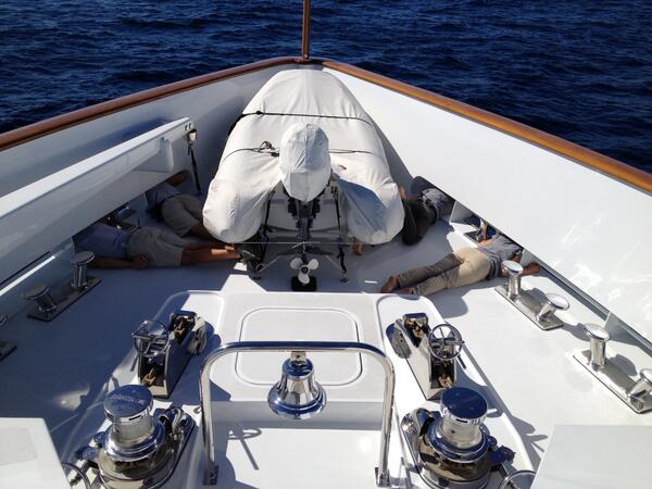 Dockwalk's tweet image. The crew of M/Y Imagine saw dolphins while underway and Mate Alex took this pic of his crew getting a closer look.