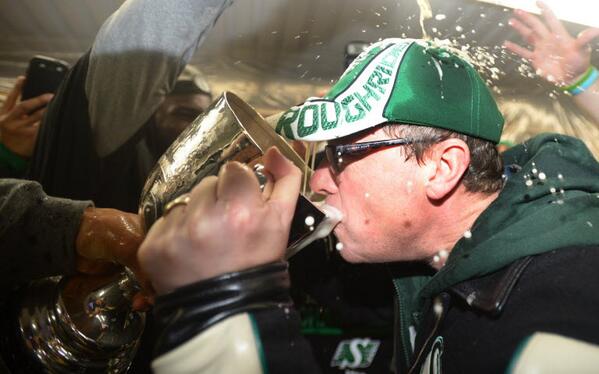 Saskatchewan <a href="/PremierBradWall/">PremierBradWall</a> drinks out of the Grey Cup. CP Photo/Jonathan Hayward #spnews