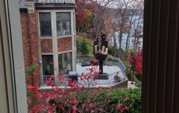 BuzzFeed's tweet photo. Strip Club Owner Buys House Next Door To Ex-Wife And Installs $7,000 Middle Finger Statue
http://t.co/Uyp0YluU9P http://t.co/GUttCm90Yu
