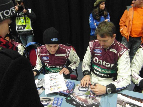 LisaStathamart's tweet image. My @WalesRallyGB photo of the day @MadsOstberg and Jonas Andersson signing my Gravel book and #WRC print :)