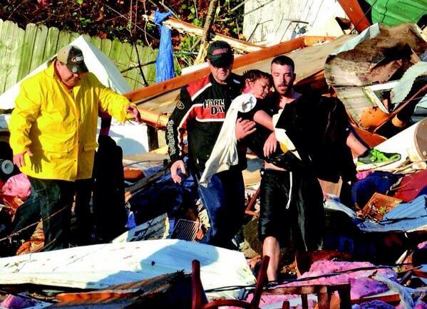 RukavinaBidwell's tweet photo. Volunteers rescue 10yr old boy after 2 hours of searching damage in Brookport, IL yesterday. Photo @PaducahSunNews http://t.co/ZXe5W1yL7l