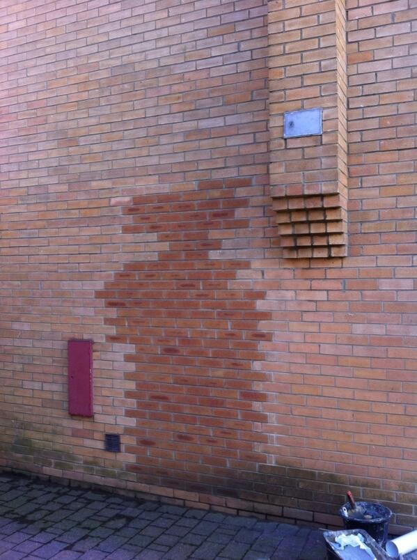 Bricked up doorway darks to light