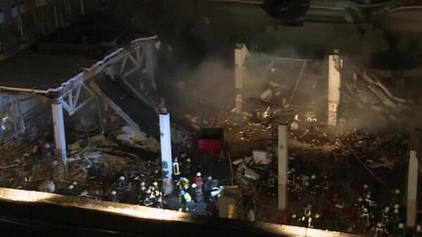 Dramatic video shows last section of #Riga supermarket roof cave in; rescuers rush to safety bbc.in/1cJ5HH6 &amp;