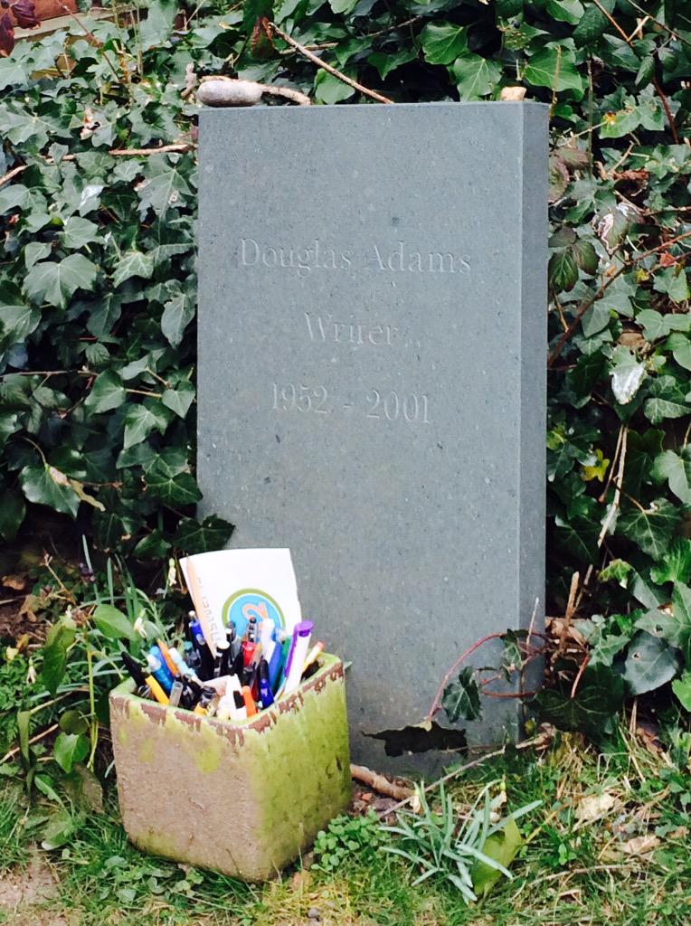 Happy Birthday Douglas Adams! Just at his grave with all the pens and this note: \"You\re dead. You bastard!\" 