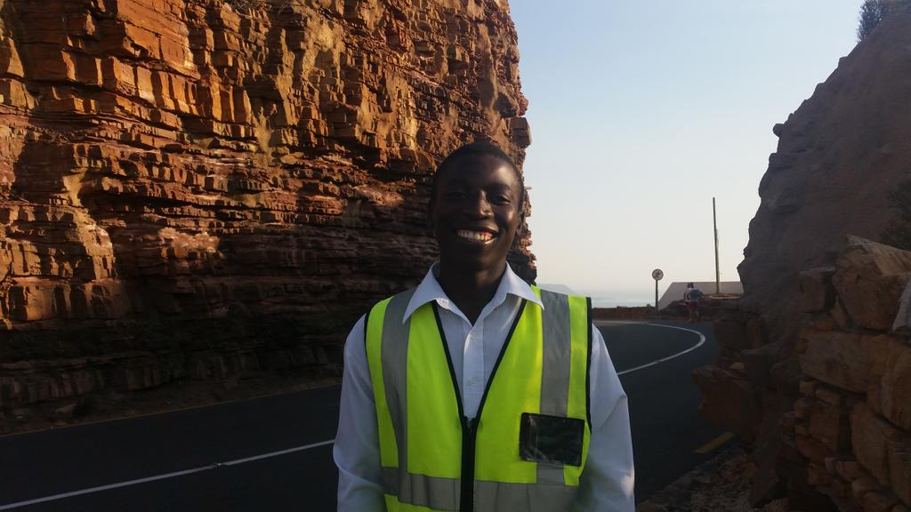 ChapmansPeakSA's tweet image. Chuma has the unfortunate task of warning cyclists &amp;amp; runners about risk of rock falls. He's still smiling though.