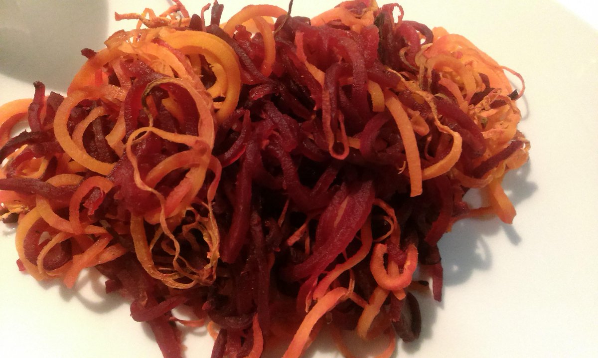 A colourful #spiralizer side dish - Baked beet and carrot noodles wp.me/p5Dk9B-2F #paleo #vegetables #recipes