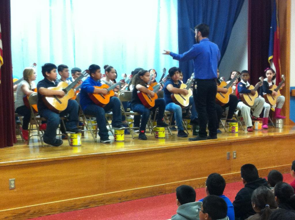 WalCreekLibrary's tweet photo. Our fab 5th grd classical guitarists and the UT Guitar Quartet wowed us with a great performance today! #AISDproud http://t.co/fwC7KSADve