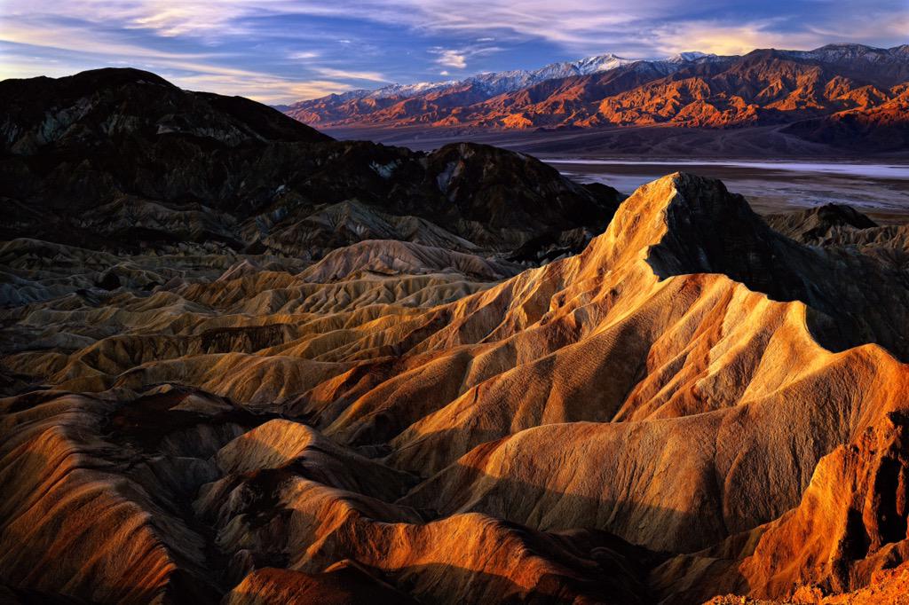 Interior's tweet photo. A view that will stop you in your tracks. #Sunrise from Zabriskie Point @DeathValleyNPS by Steve Perry http://t.co/xFyzAa0dDH