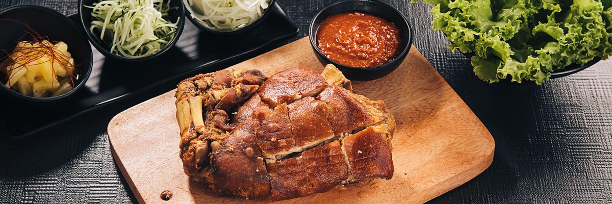 In case ramen isn't enough for you and your pork-loving friends, order the Crispy Pata Ssam. It's worth every calorie