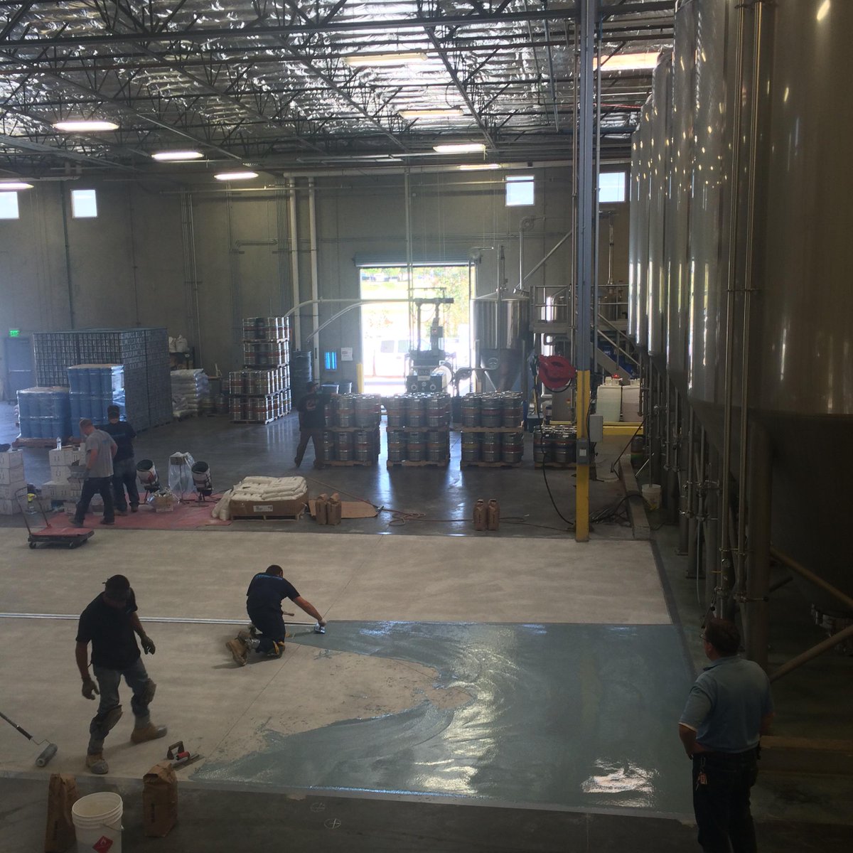 Epoxy is being laid (troweling) on the brewery floor! We are almost ready for our new tanks.  <a href="/sdbeer/">San Diego Beer Blog</a> #sdbeer