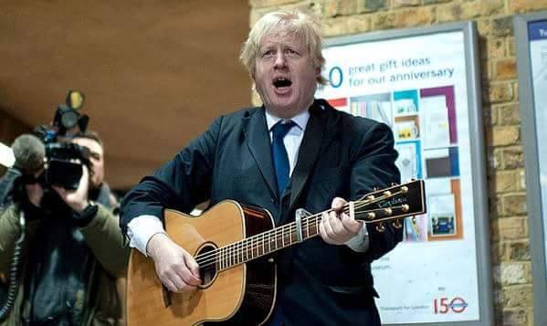 This Picture Definitively Proves That Boris Johnson Has No Idea How To Play  A Guitar